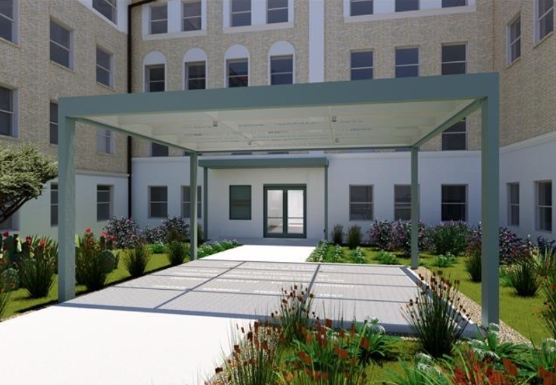 Exterior of an academic building entrance with an extended awning