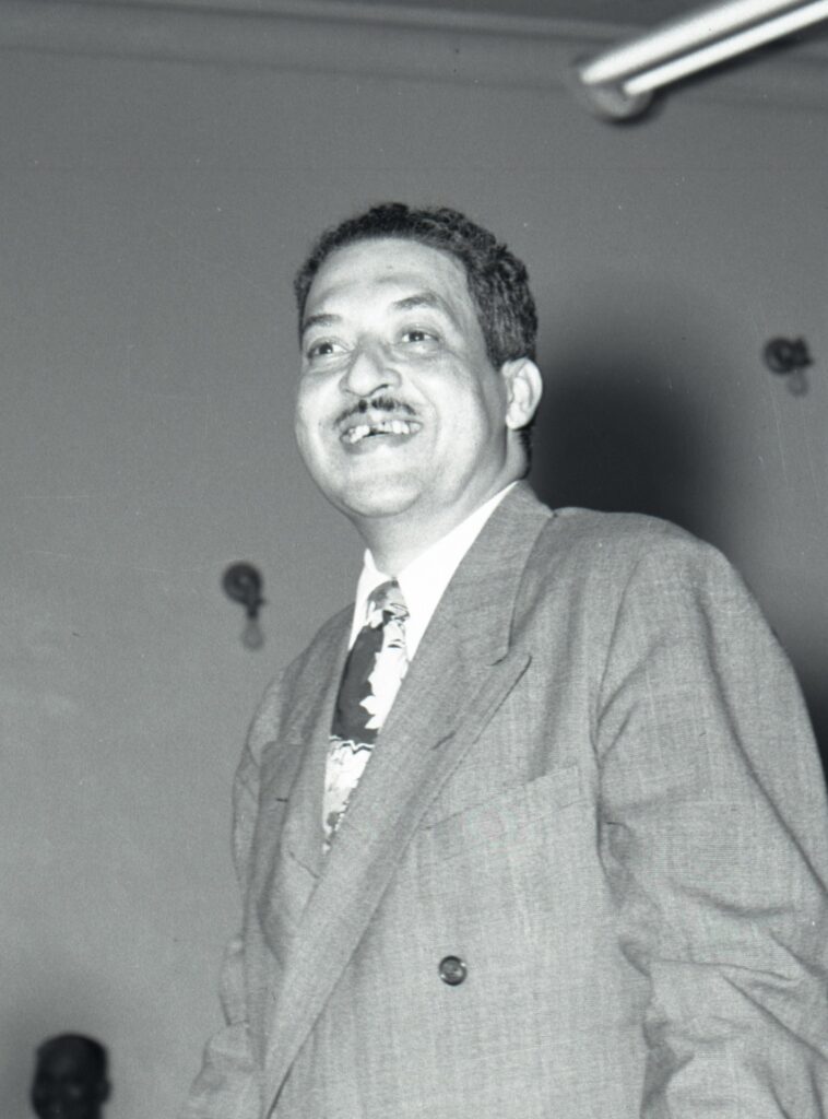 Thurgood Marshall standing at podium speaking